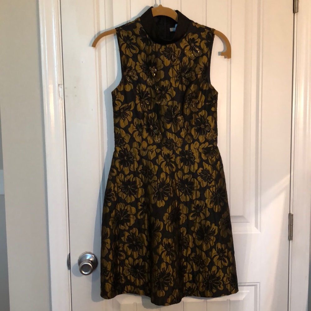 Black and gold cocktail dress.